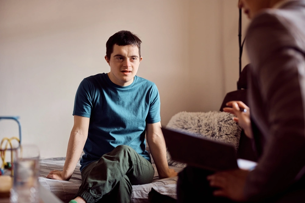 a downsyndrome boy going through a mental therapy session