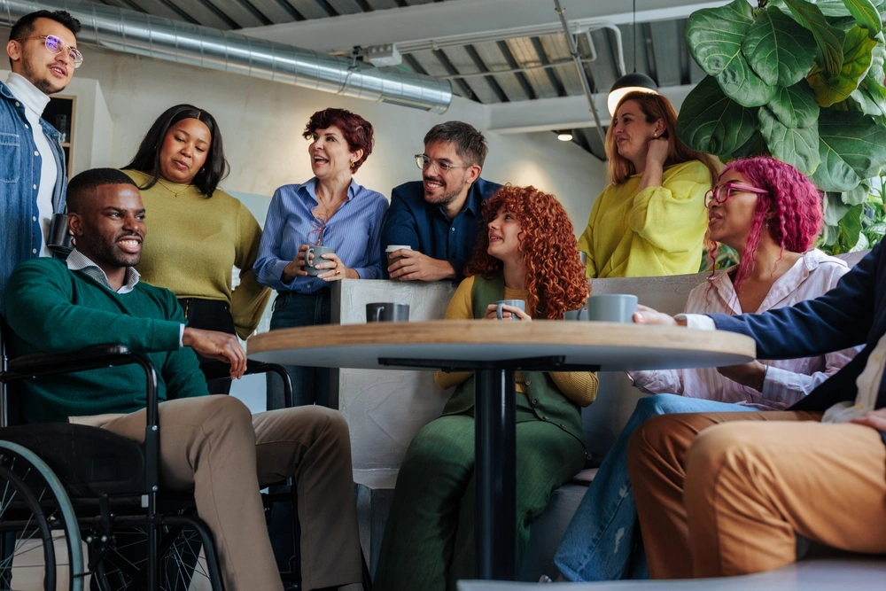 group of individuals with different disabilities chatting together